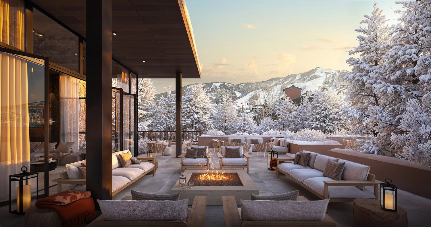Snowy mountain lodge patio with fire pit